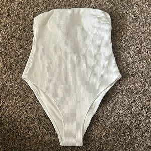 White 1 piece bathing suit.